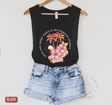 A black tank top with a graphic design of palm trees and flowers, along with the text